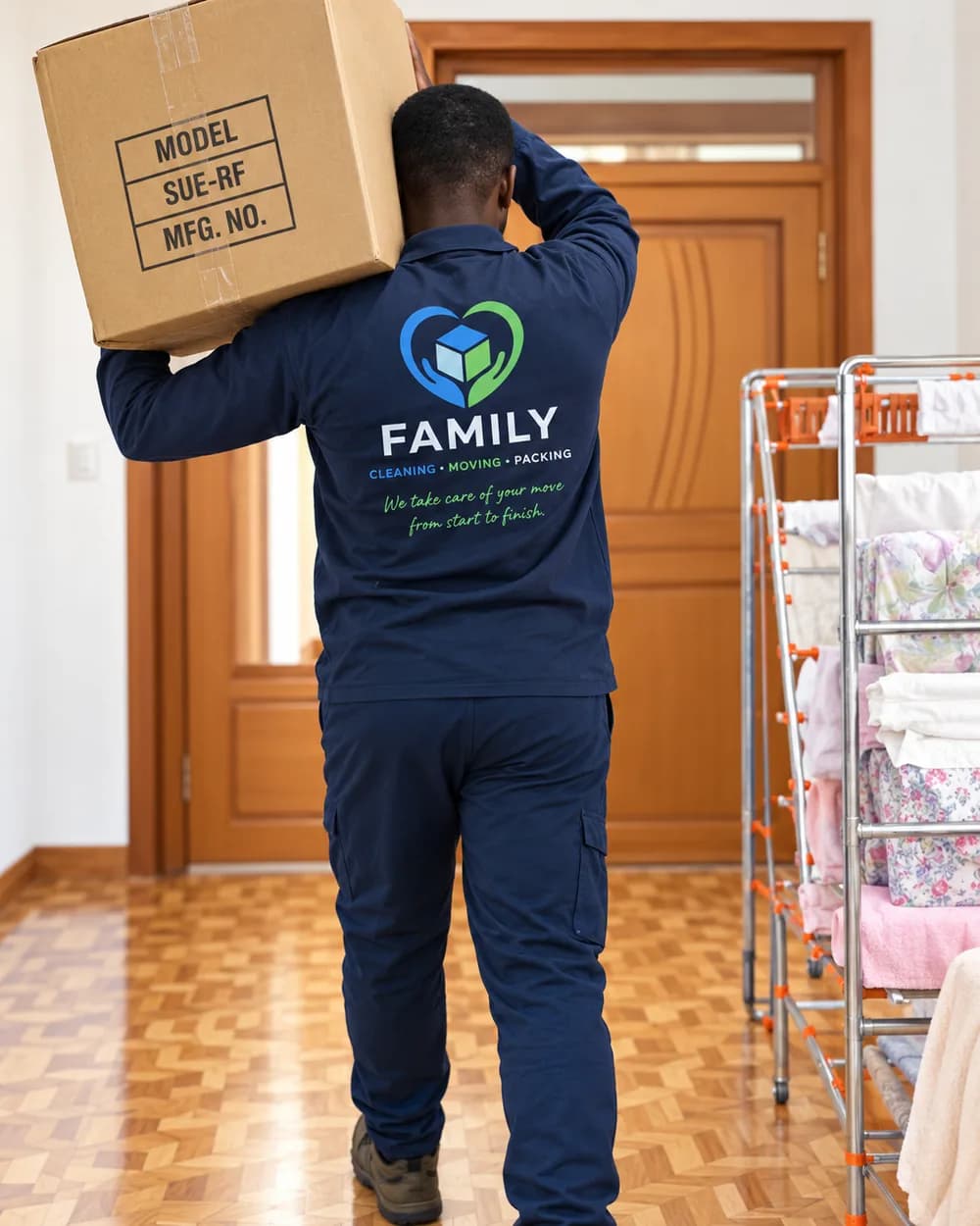 FAMILY mover carrying a packed box during a residential move